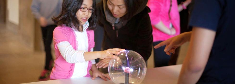 Science Saturday image header of a girl participating in a previous science Saturday.