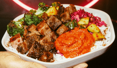 Sweetgreen Bowl held by a hand
