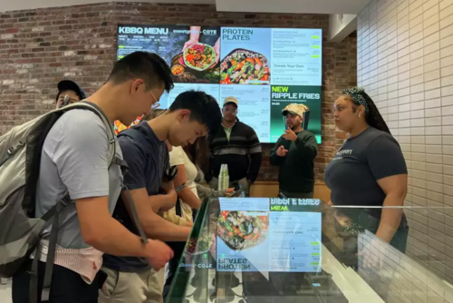 Customers line to order food at Sweetgreen