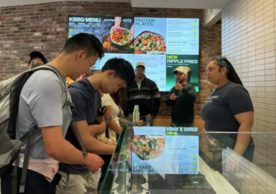 Customers line to order food at Sweetgreen